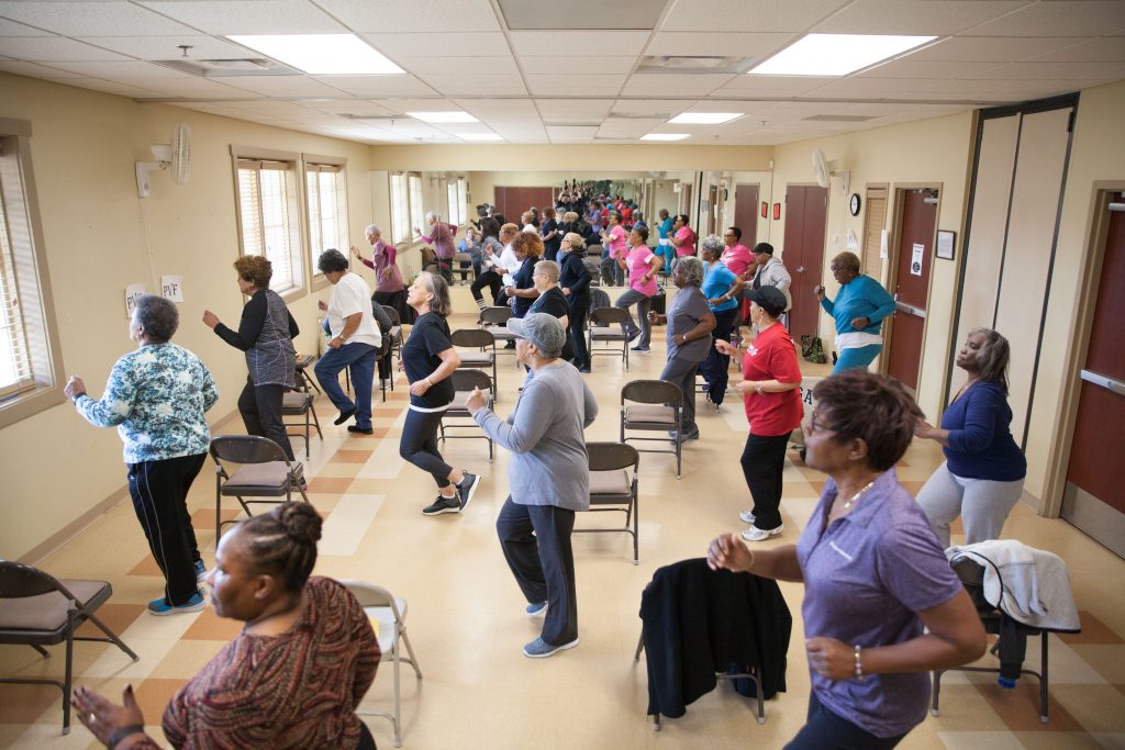 Women exercise during a group class