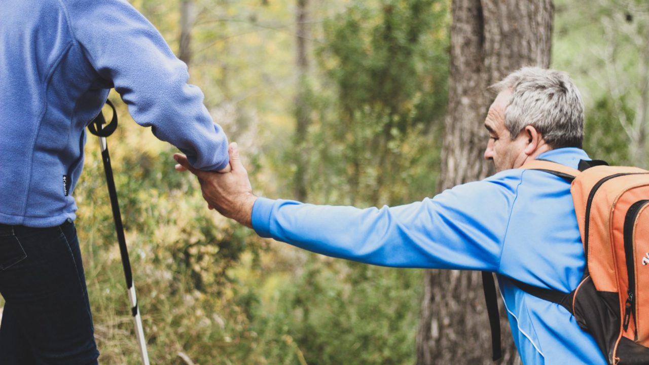 Two Older Men Helping Each Other Out