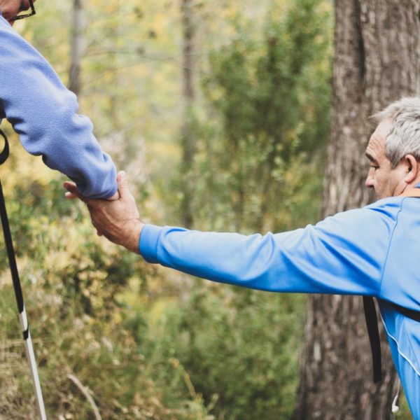 Two Older Men Helping Each Other Out